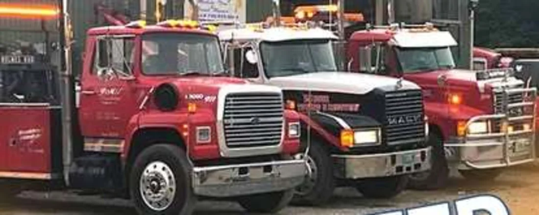 JMF wrecker fleet lined up outside the Thomaston shop